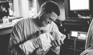 dad holds baby first time