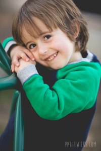 little boy smiling at camera (austin child photographer)