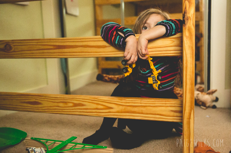 little girl playing with trucks (austin lifestlye photographer)