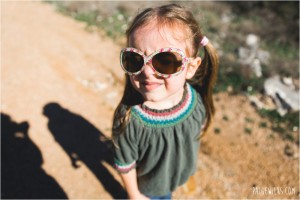 little girl pigtails flower sunglasses harsh light