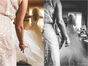 adjusting brides dress and veil