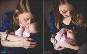 new mother kisses and smiles at newborn daughter