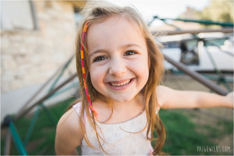 little girl with hair wrap smiling