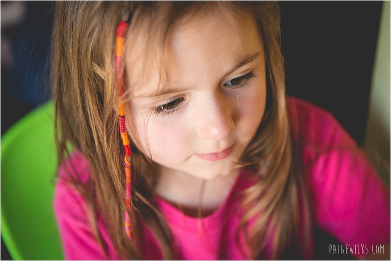 little girl in pink shirt with hair wrap