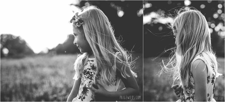 little girl black and white wind blown hair gazing off