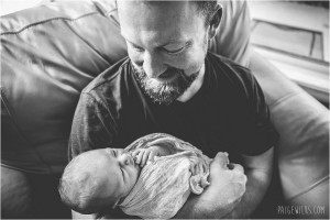 father and newborn son natural light black and white
