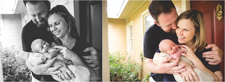 new parents smiling with baby 