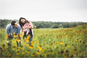 family of three in field of flowers brushy creek photographer
