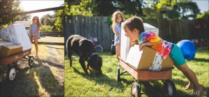 kids pulling wagon with package bookshark