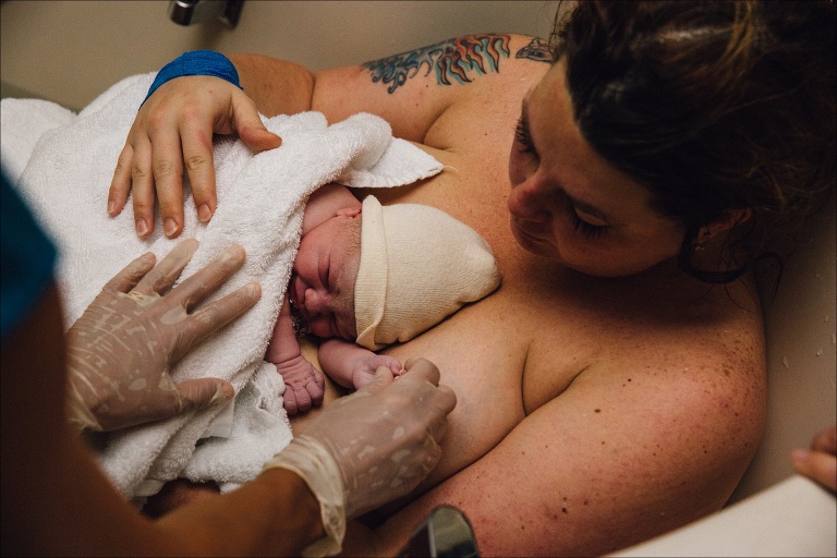 mother holds newborn birth photogrpaphy